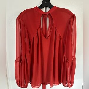 Orange tie back sheer blouse